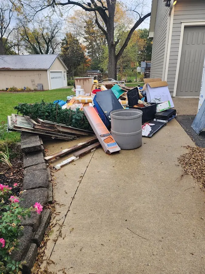 Dumpster being loaded with debris for Commercial Dumpster Rental in Valdese